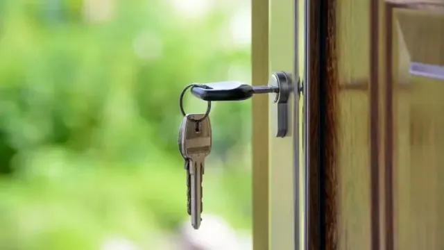 House keys in the lock of a door.