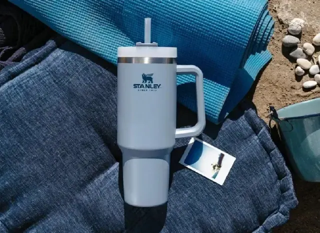 A blue Stanley tumbler on a blue yoga mat, Stanley Speaks Out on Claims That Their Water Bottles Contain Lead