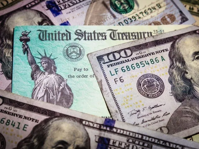 Cash and a U.S. Treasury check; illustrative archive photograph.