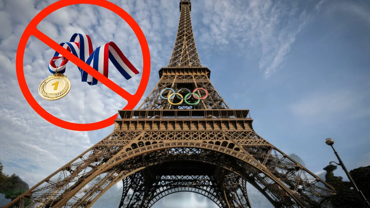 The Eiffel Tower with the colorful Olympic rings with a first placed medal with a red cross over it