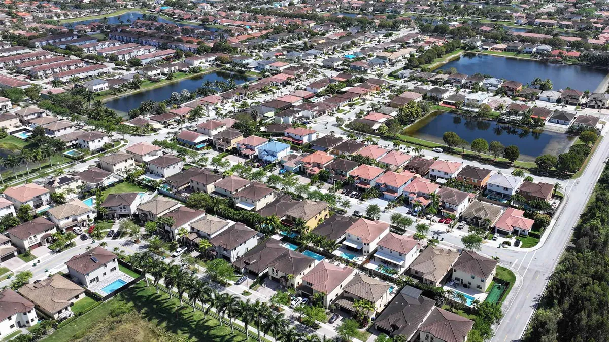 : In an aerial view, homes sit on lots in a residential neighborhood on March 15, 2024, in Miami, Florida.
