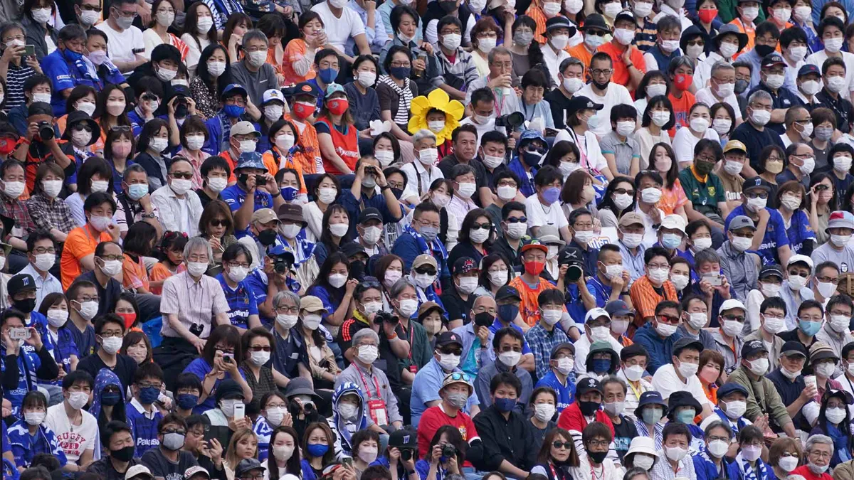 Spectators wearing masks are seen in the stands during the NTT Japan Rugby League One Play Off semi final between Saitama Panasonic Wild Knights and Kubota Spears Funabashi Tokyo Bay at Prince Chichibu Memorial Ground on May 22, 2022 in Tokyo, Japan.