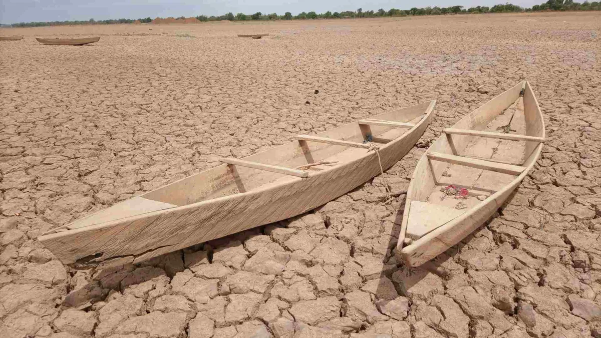 Boats lying in a dry desert.