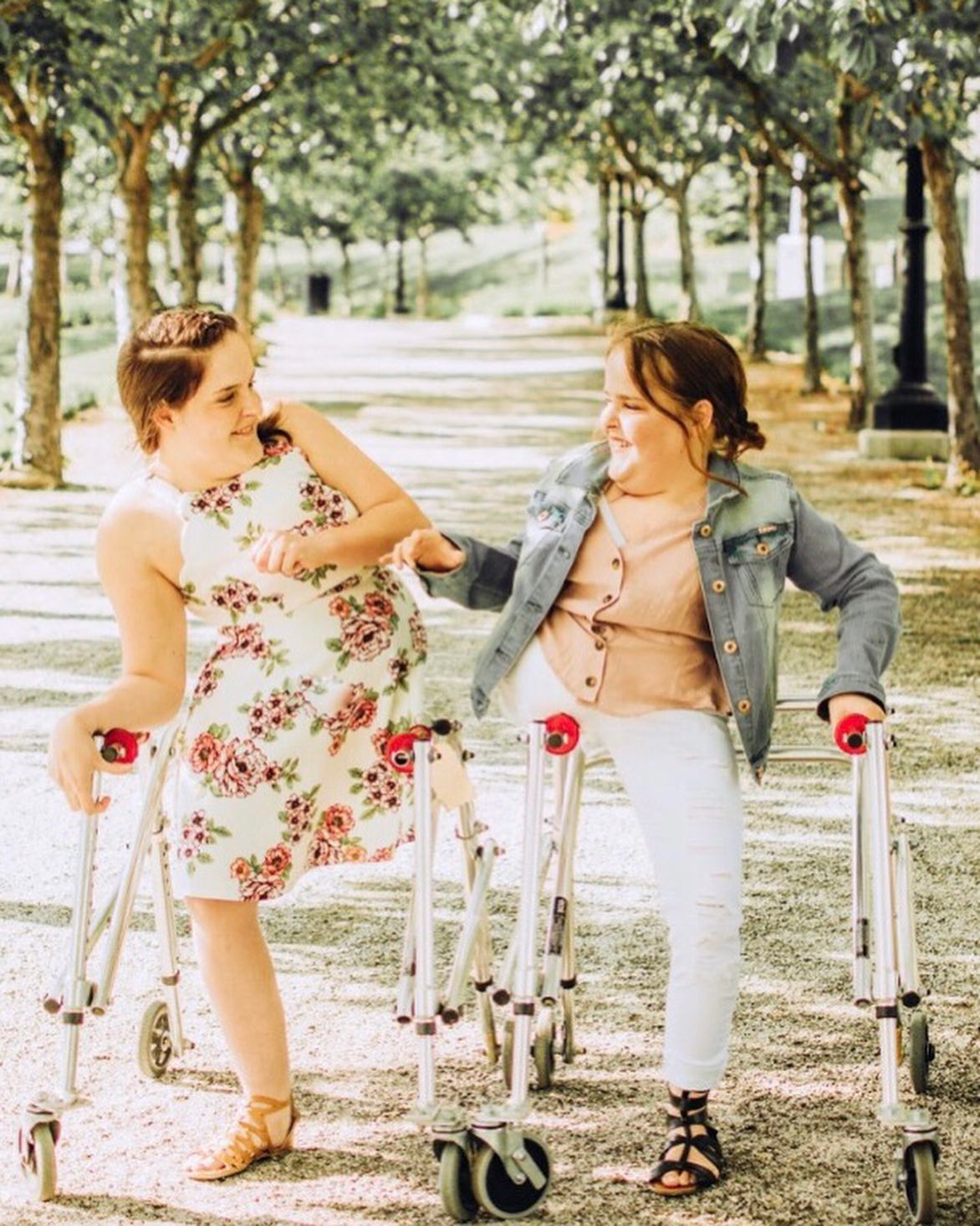 The sisters using mobility aids outdoors
