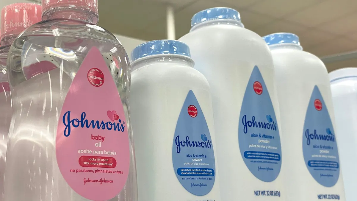An up-close look at Johnson & Johnson products, including baby oil and talcum powder, on a store’s shelves.