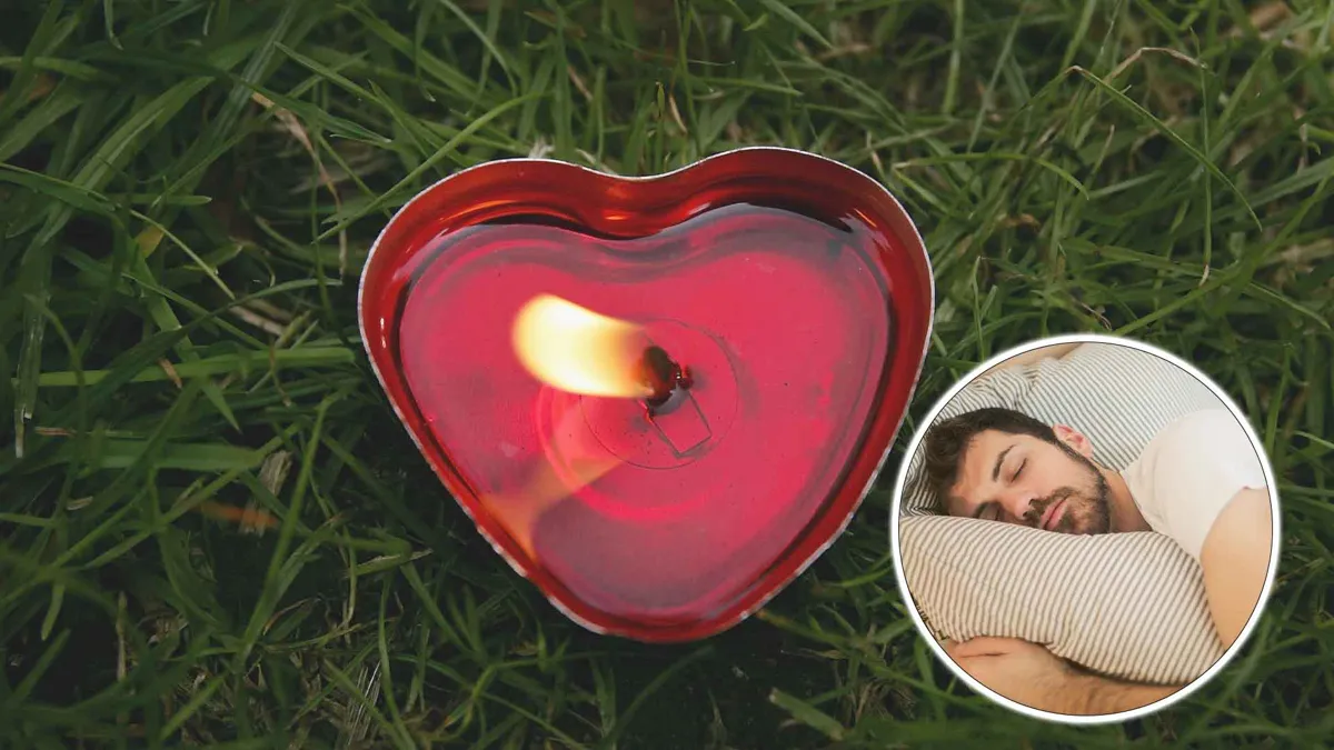 lit heart candle with man sleeping overlaid