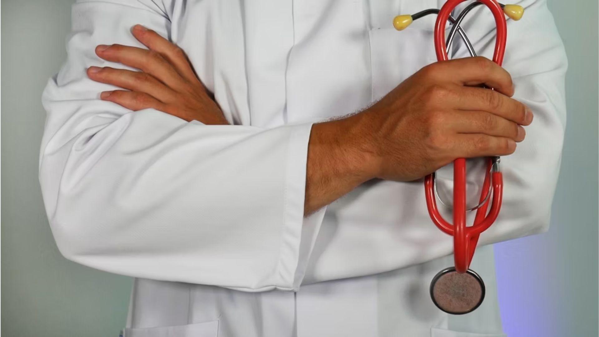 A clinician holding a stethoscope; illustrative archive photograph.