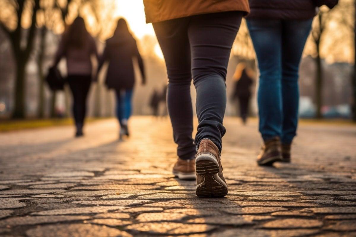 People walking on a path; illustrative archive photograph.