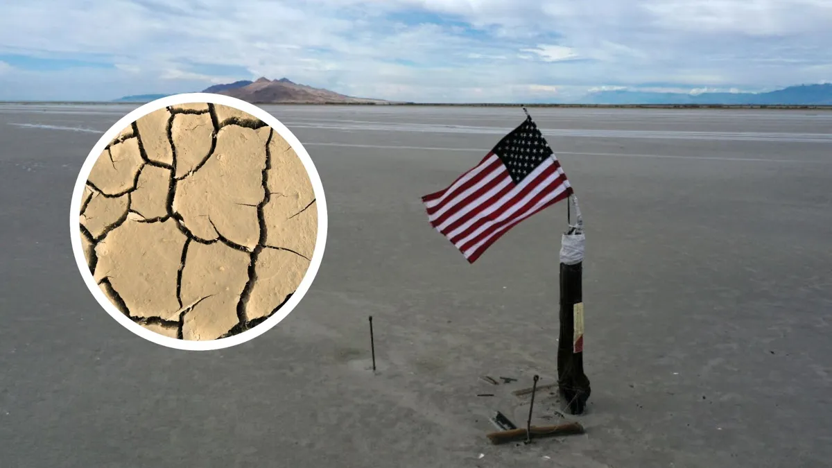 A view of a dried lake bed with an American flag planted in it and a photo of a dried and cracked surface added over top