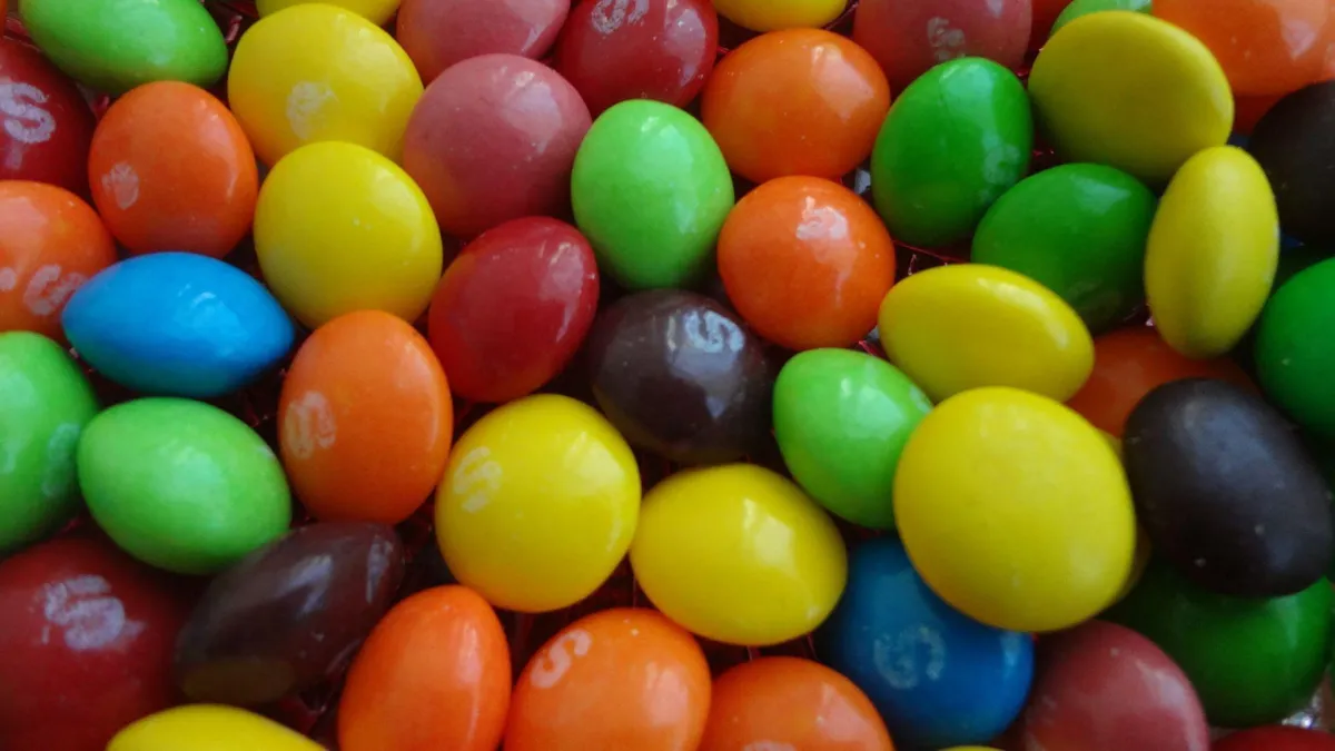 A close-up of many colorful Skittles.