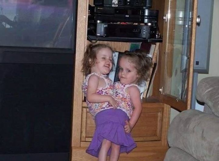 The twins in an archived childhood photograph