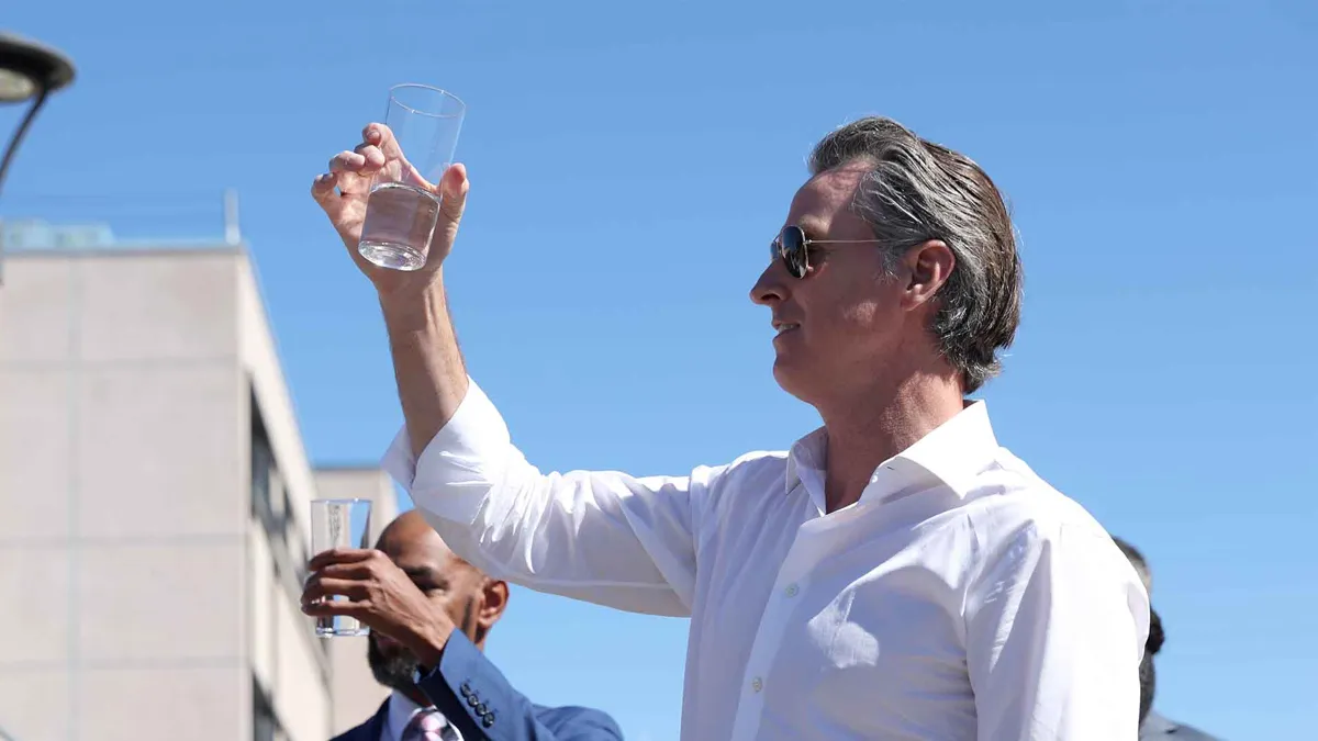 California Gov. Gavin Newsom prepares to taste wastewater that was treated at the Antioch Water Treatment Plant