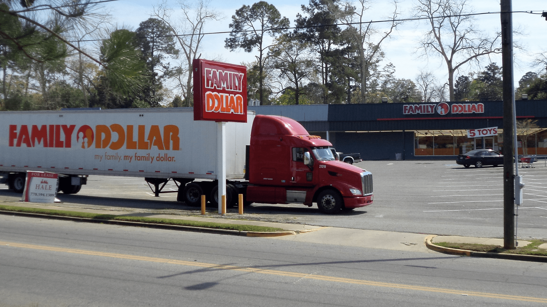 A Family Dollar truck and storefront; archive photograph.