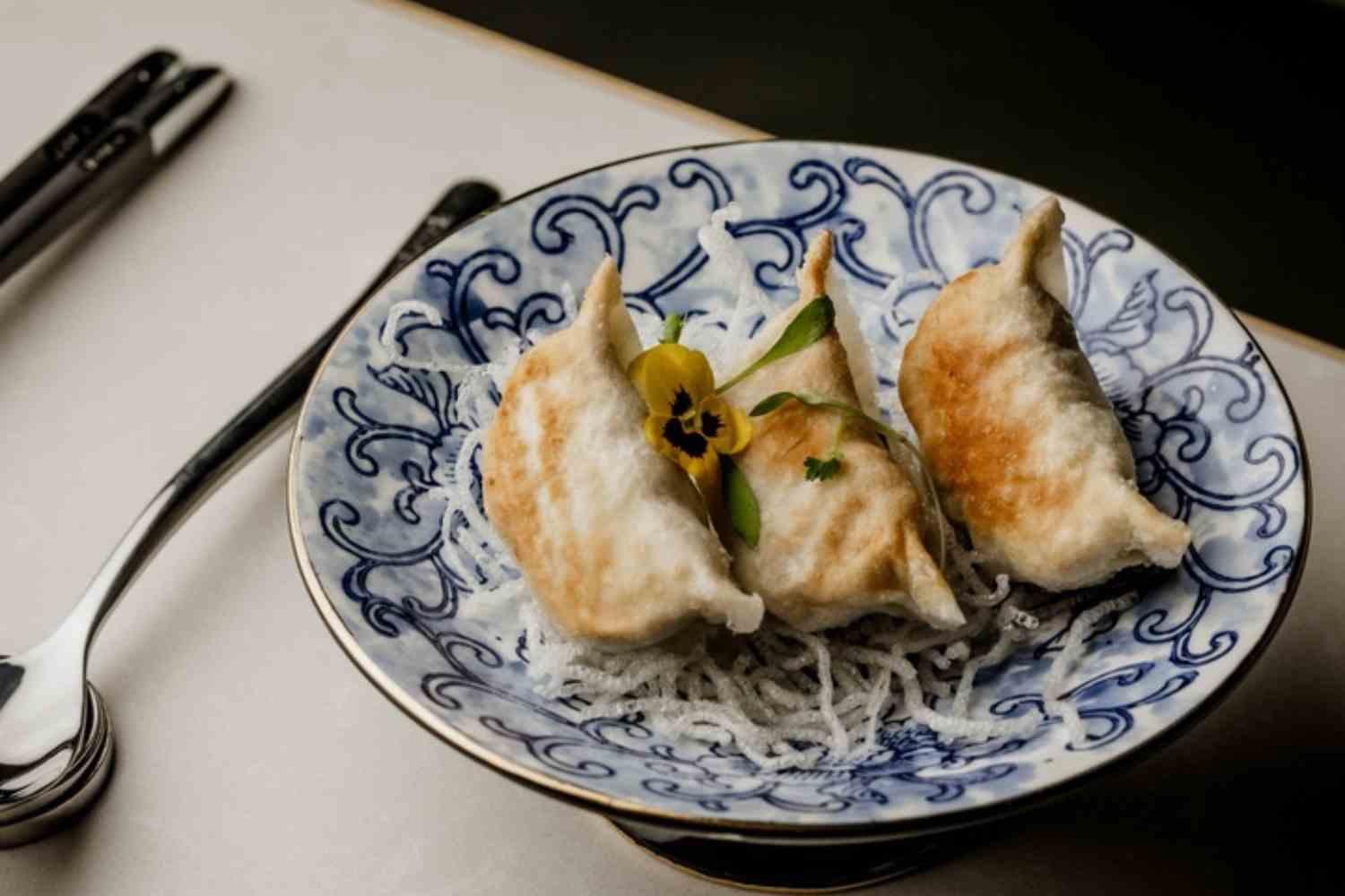 Food served on a patterned plate in an archive photograph.