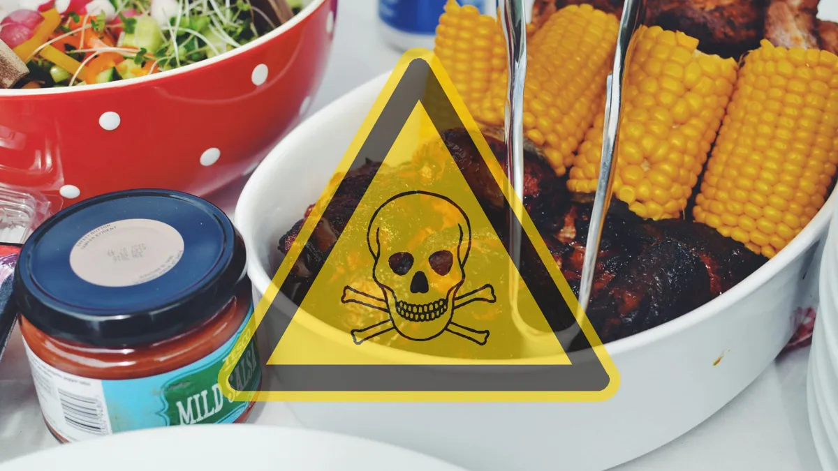 A plate of bbq chicken and corn with a skull and cross bones warning on overlaid on the photo