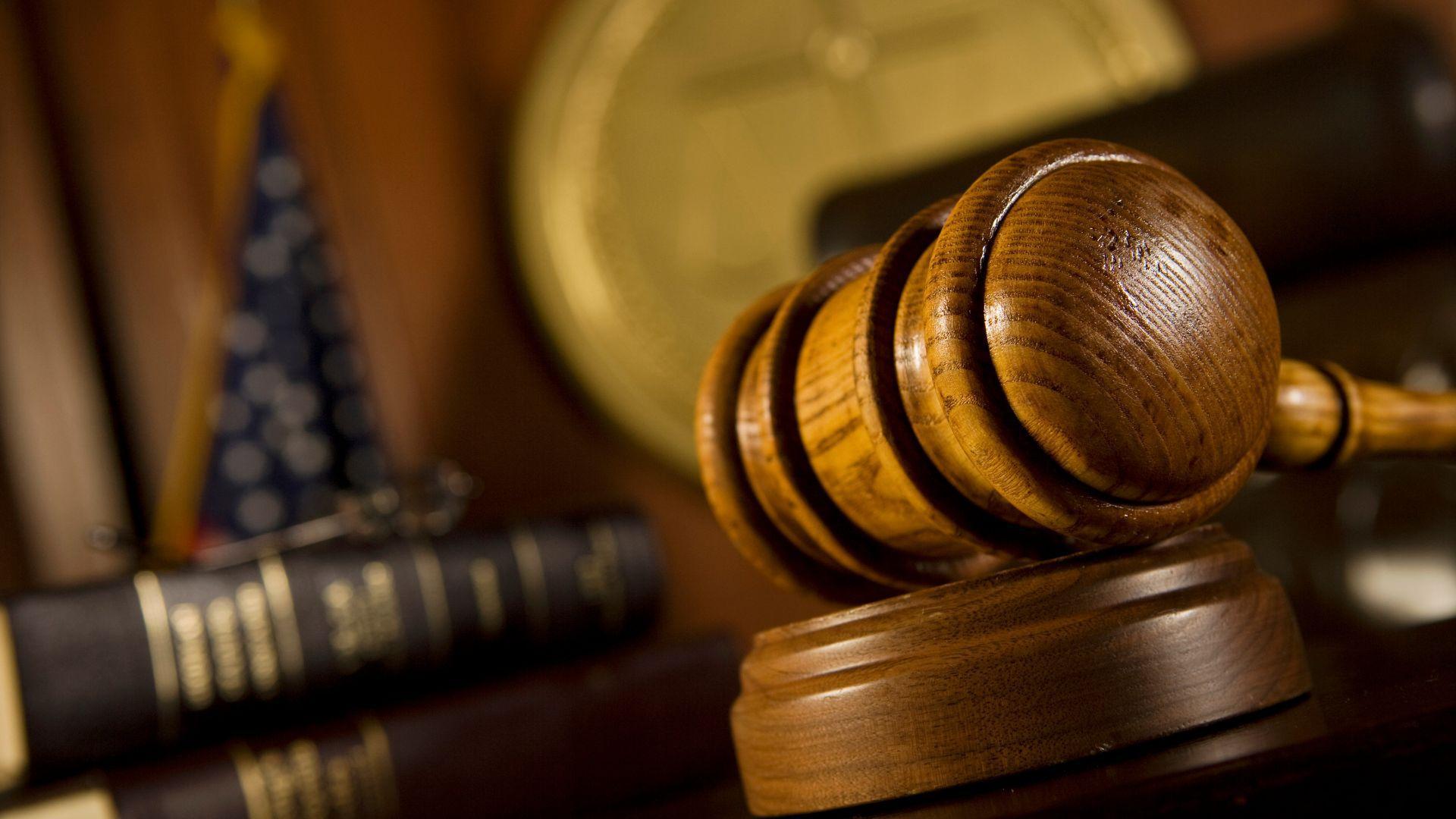 Illustrative stock photograph of a judge’s gavel and law books.