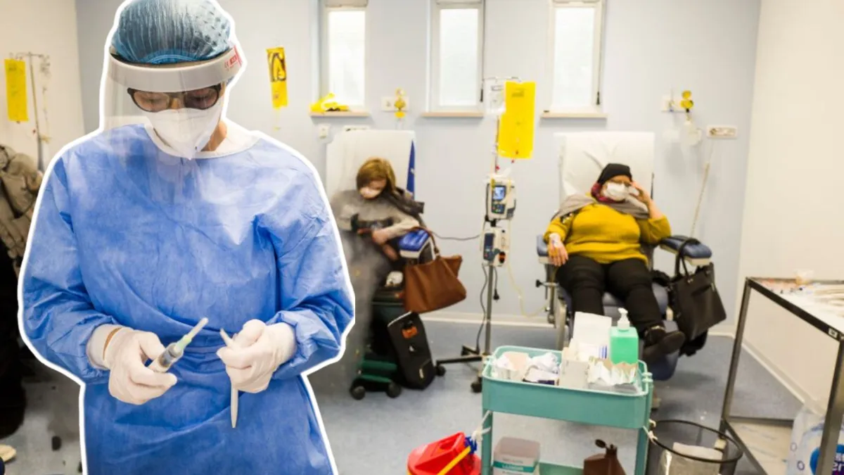 A nurse wearing a blue smock and full PPE stands in front of two people receiving chemotherapy