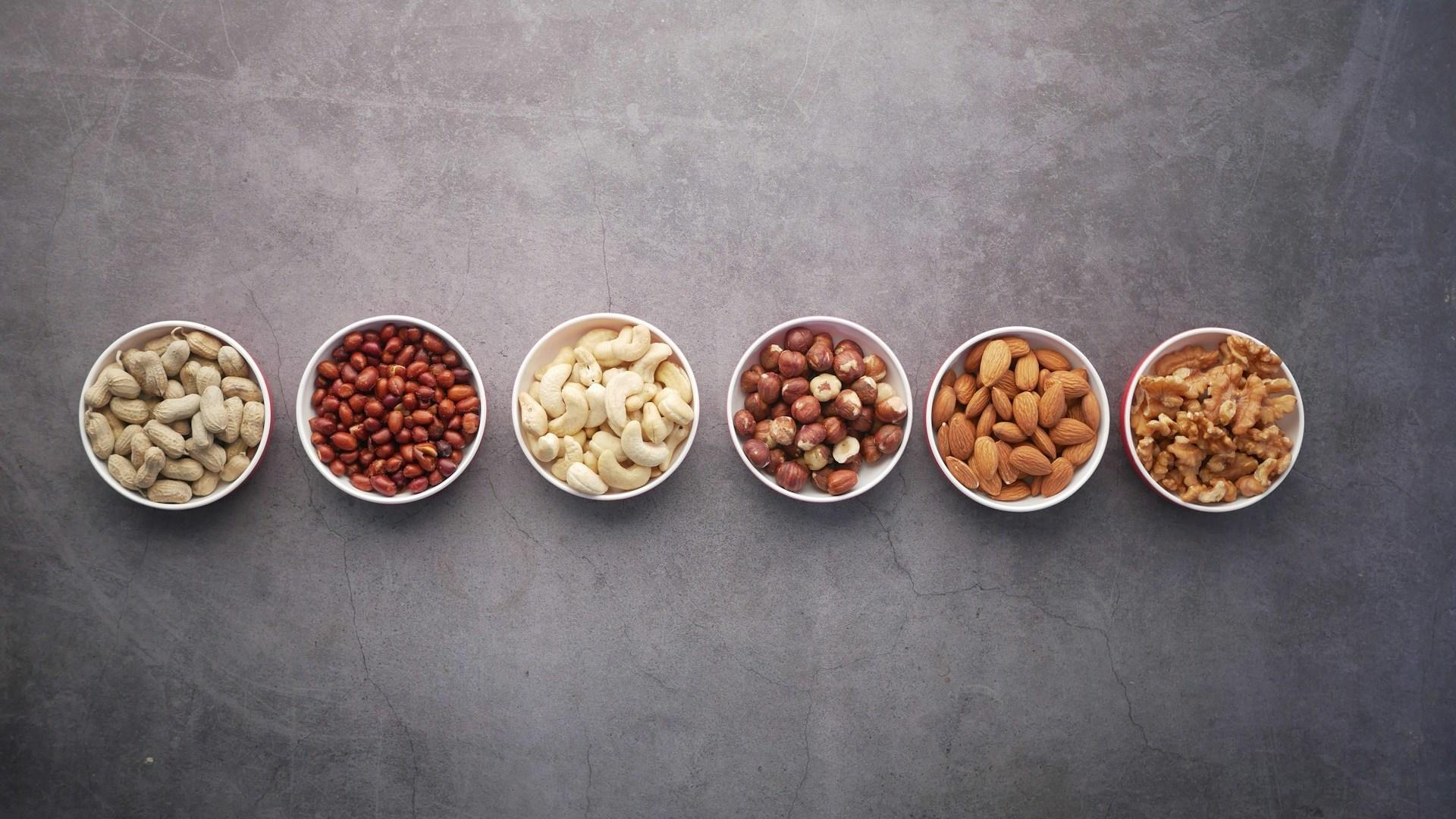 Bowls of nuts and legumes; illustrative archive photograph.