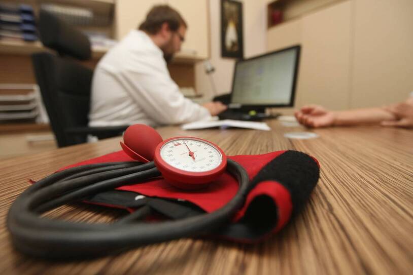 A blood-pressure cuff in a medical office, an illustrative health image