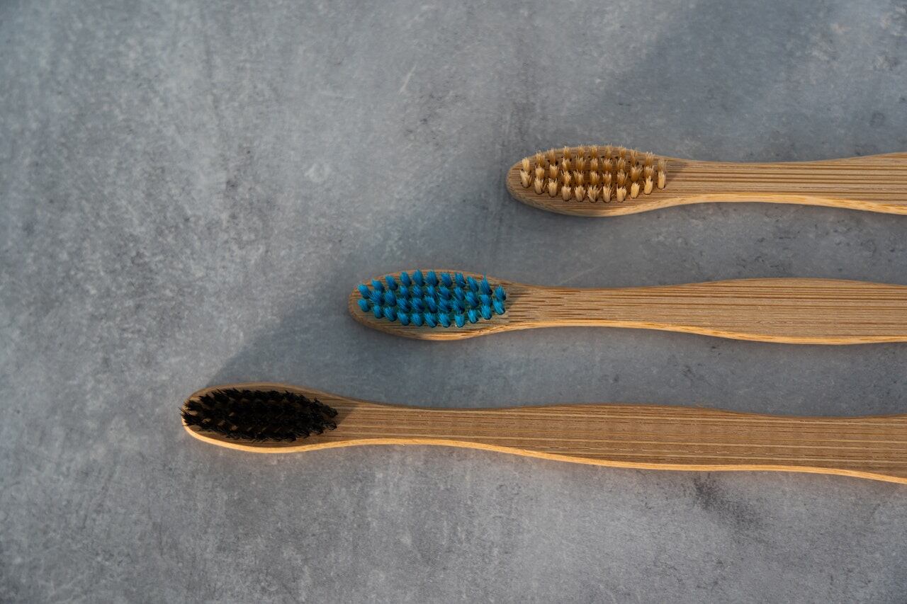 Wooden toothbrushes laid on a surface