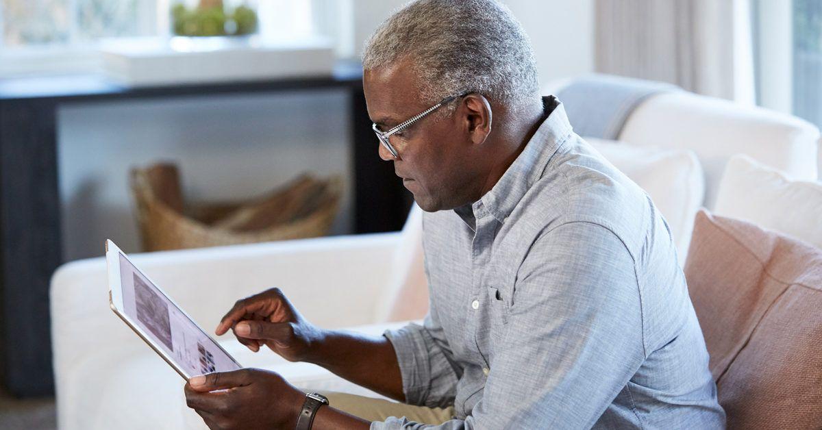 A person using a tablet; illustrative archive photograph.