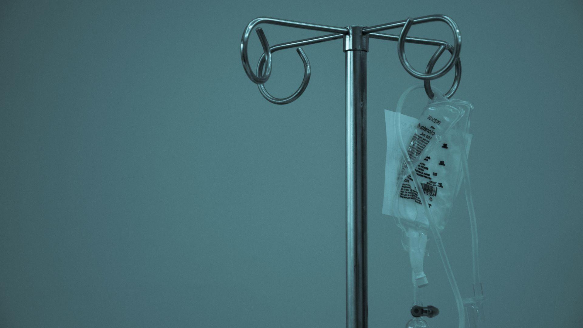 Illustrative stock photograph of an intravenous fluid bag and stand.