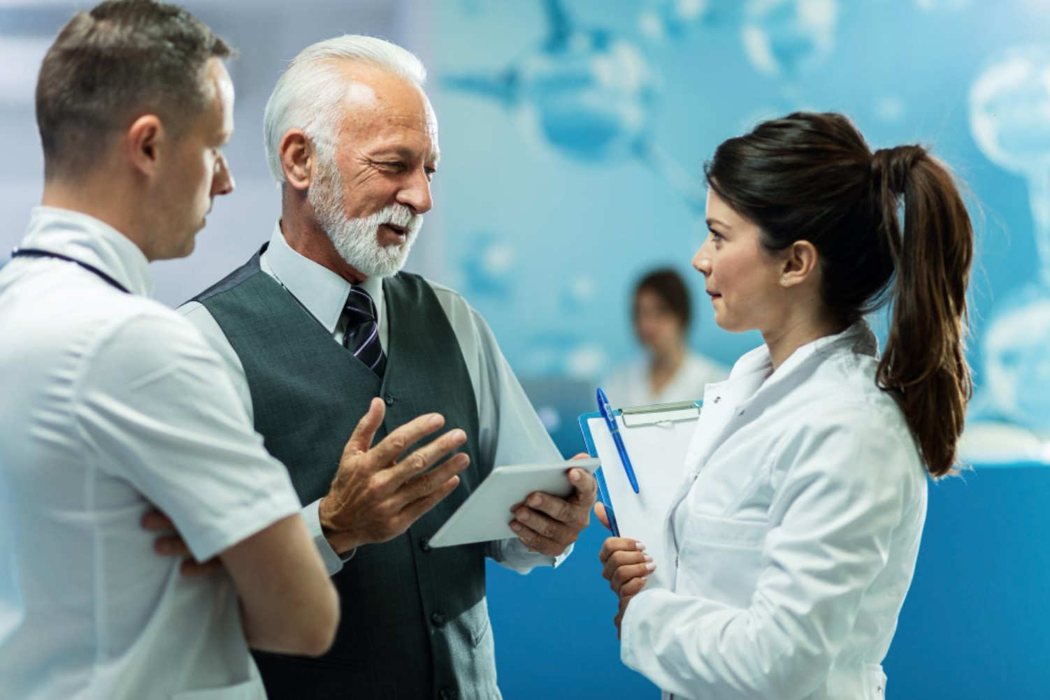Clinician speaking with an older patient; illustrative image