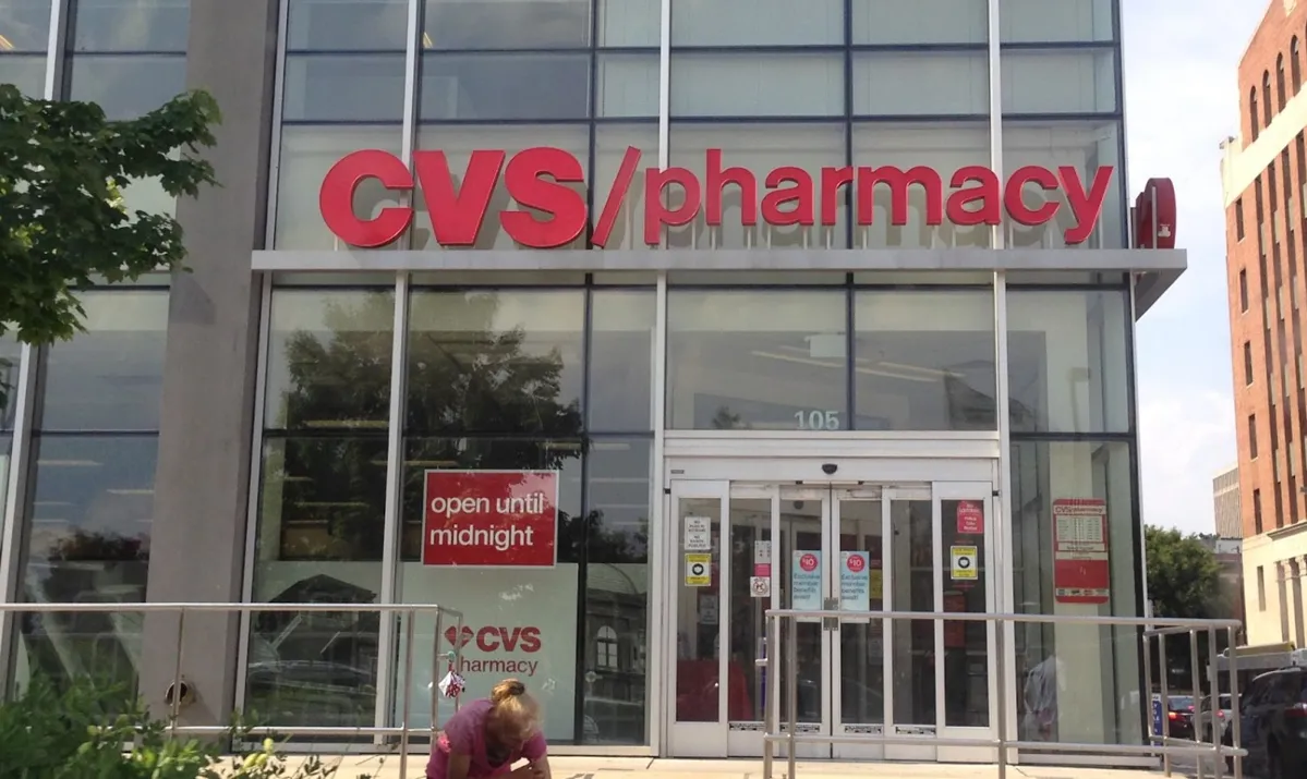 A photograph taken outside of a large CVS pharmacy store in Baltimore, Maryland