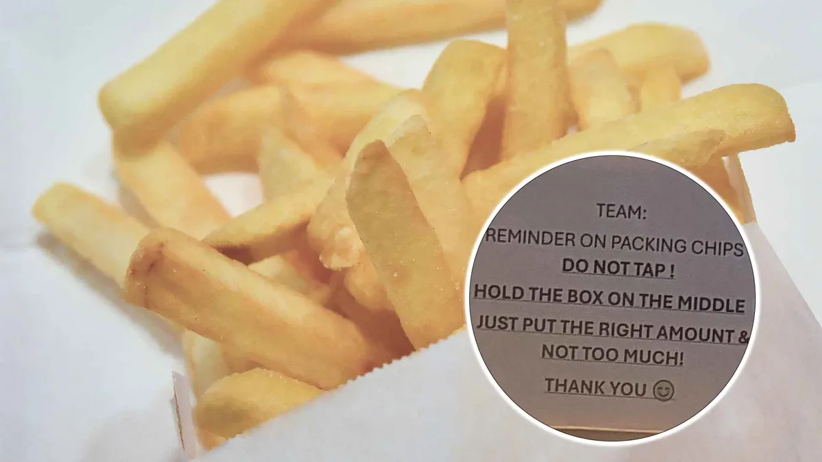 General view of close up of French Fries and team member note at fast food restaurant
