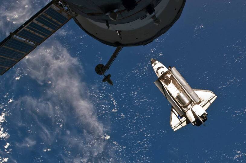 A space shuttle above Earth, an archival mission image