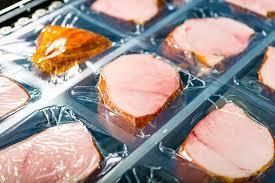 Packaged meat in a retail display; illustrative archive photograph.