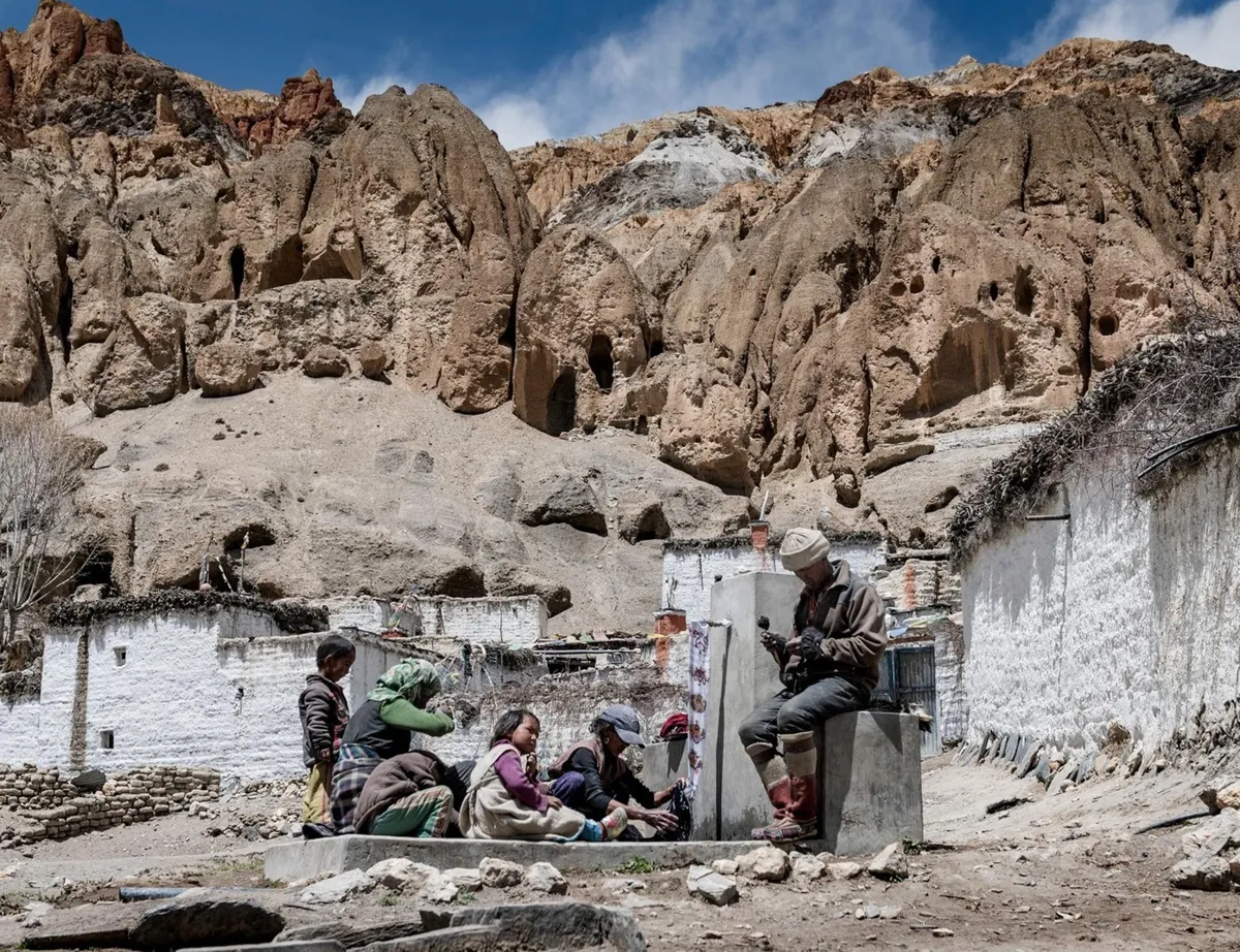 A photograph of the ancient town of Samdzong in Upper Mustang, Nepal, and its few residents