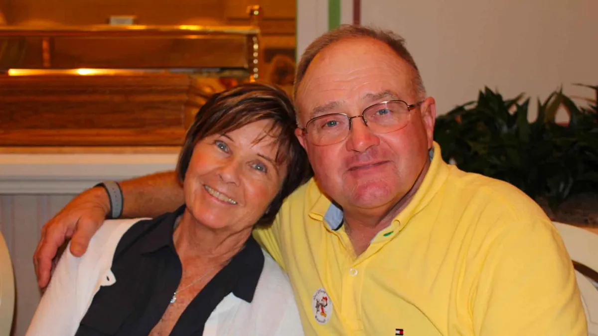 Paul and Sue Rosenau pose together in their home