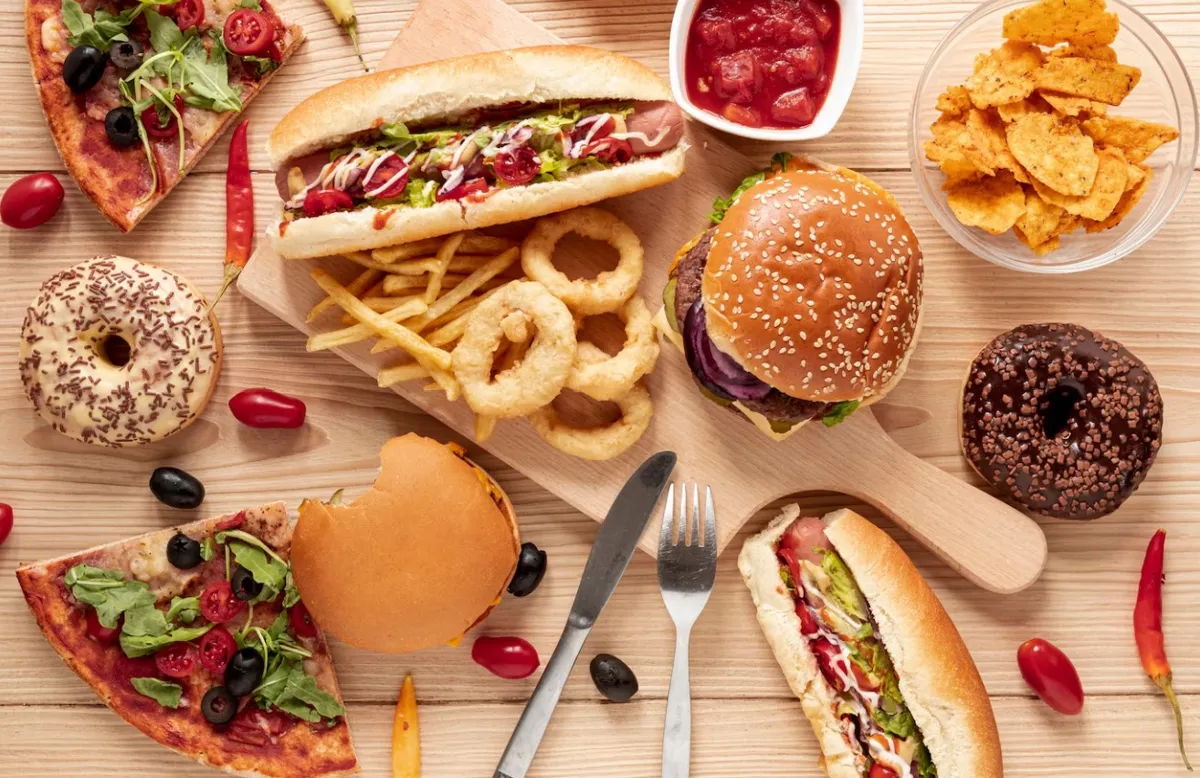 Spread of fast food on a wooden table