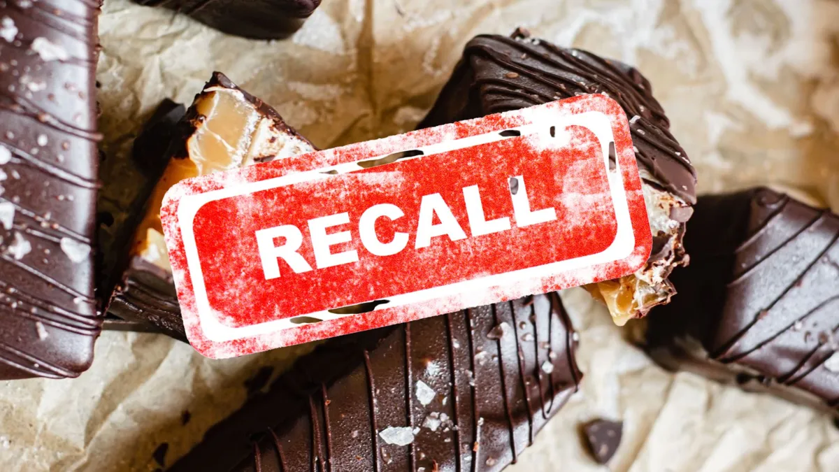 Chocolate bars with a red recall notice stamped on the photo
