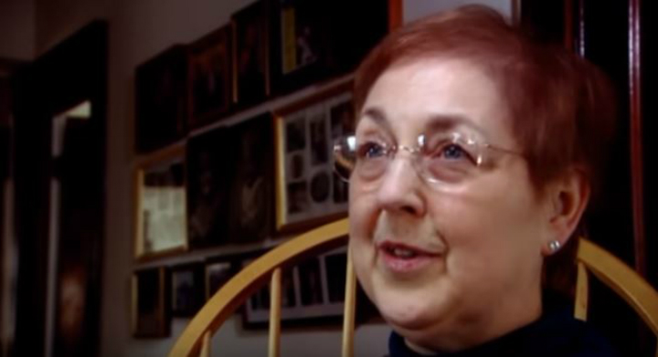 A woman speaking in an archived documentary interview
