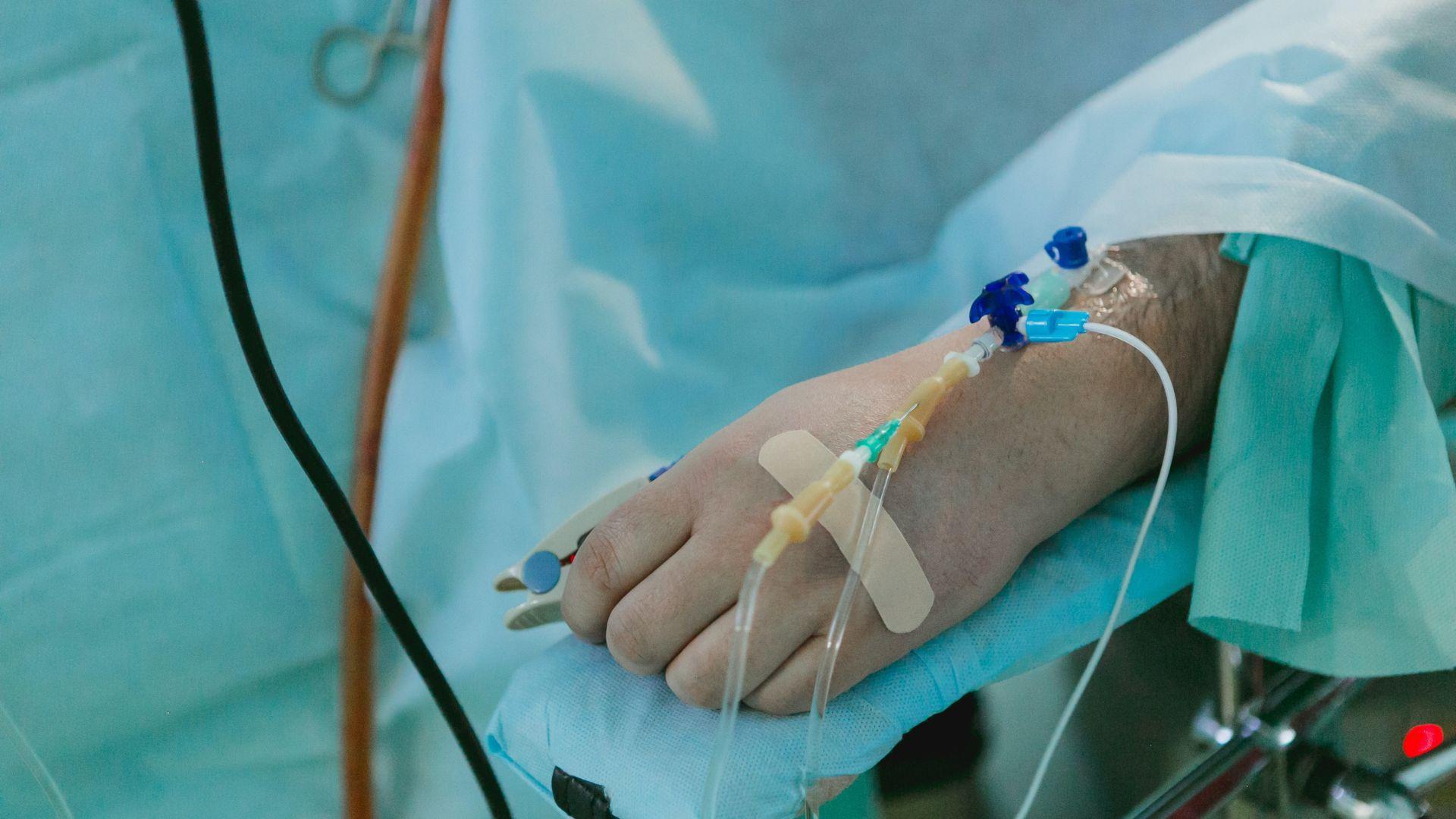 An IV line attached to a person’s hand