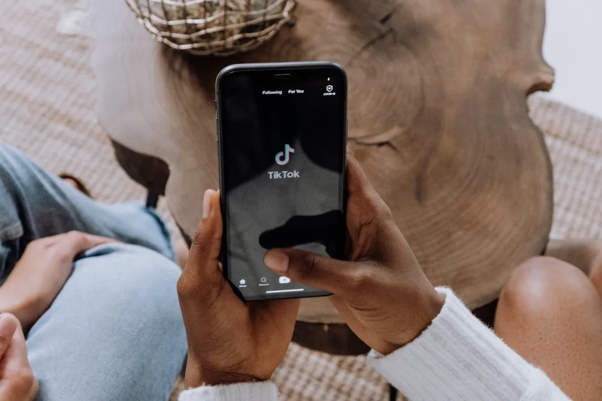 Person Opening TikTok App on Iphone