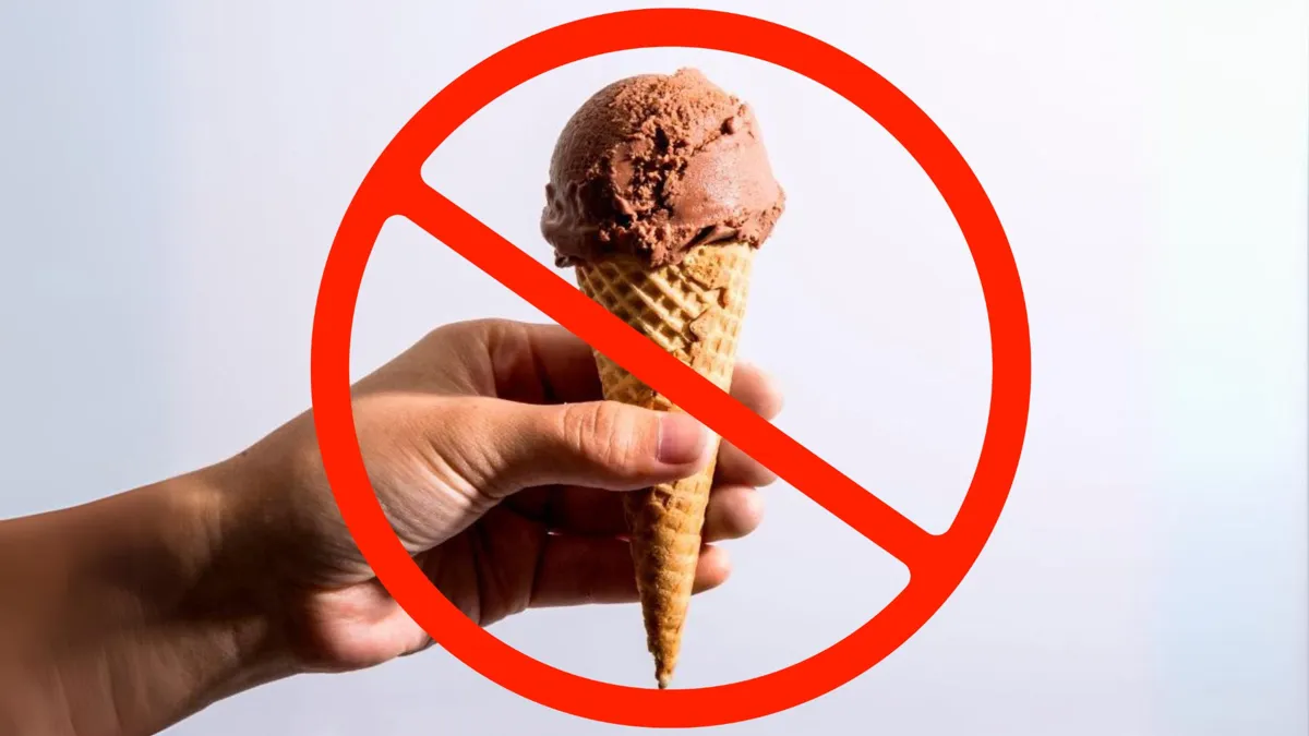 A man holding an ice cream cone with a large red crossed out circle imposed on it