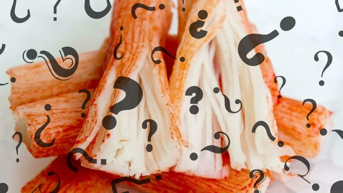A photograph of imitation crab sticks superimposed with several black question marks