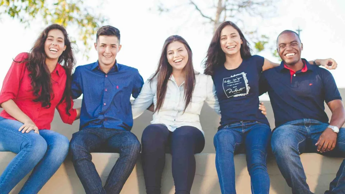 A group of people smiling together.
