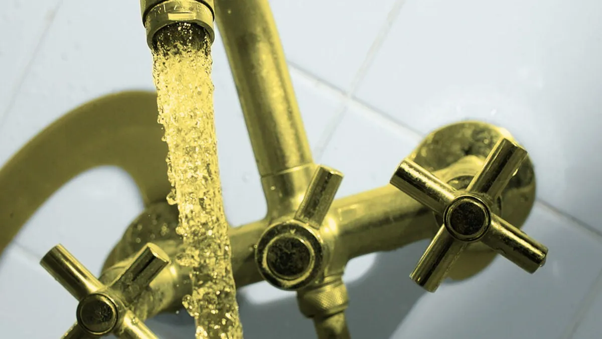 A photograph of a tap releasing water, colored yellow to depict toxins