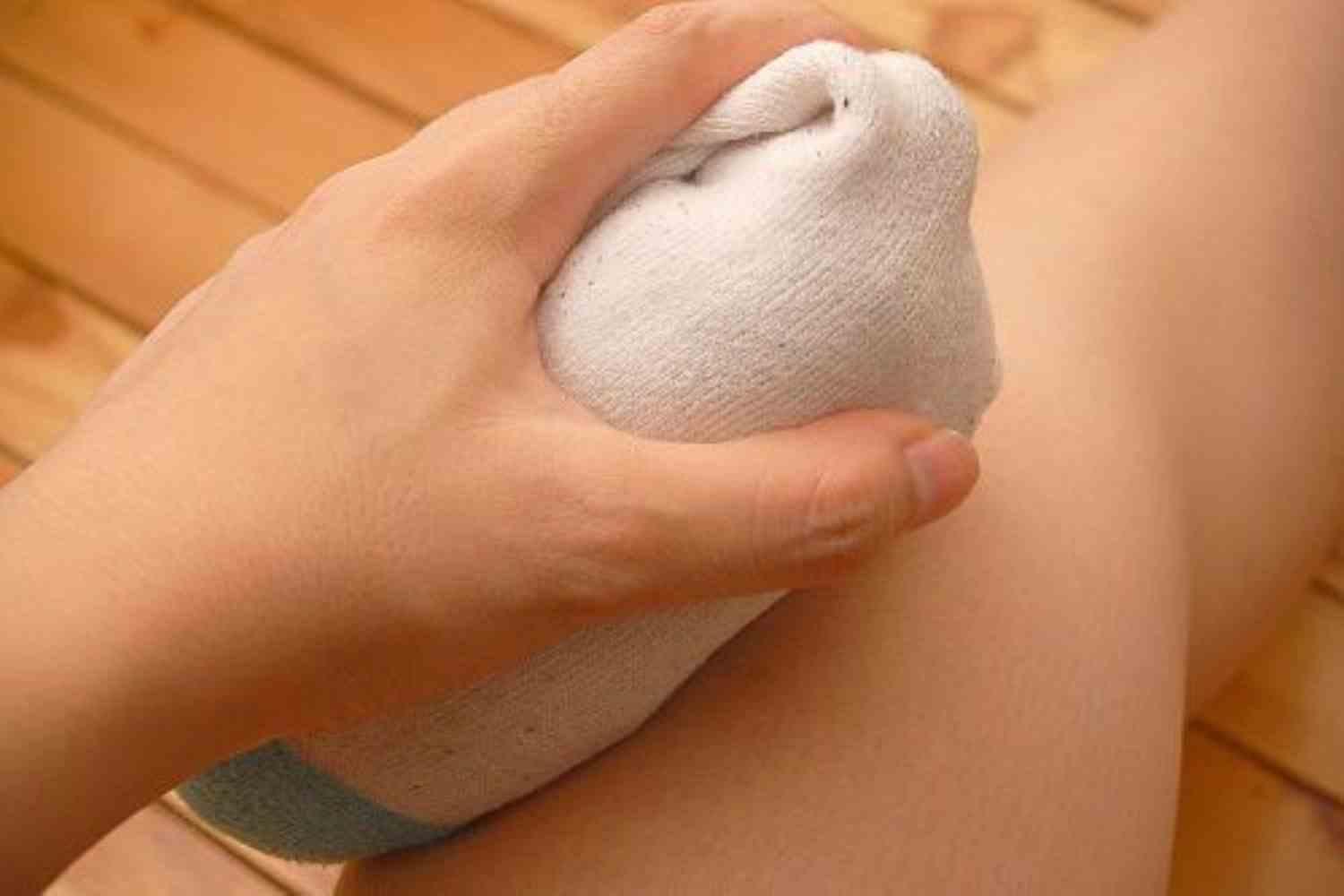 A fabric pouch held against the body in an archive photograph.