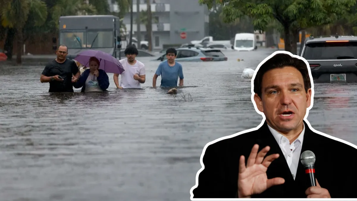 A family walks through waist high water during a flood with a photo of Gov. Ron DeSantis imposed