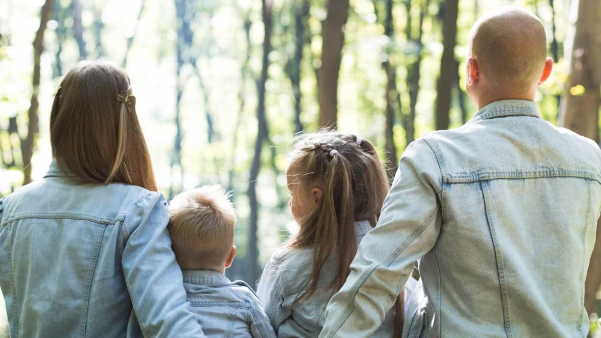 A family walking outdoors; illustrative archive photograph.