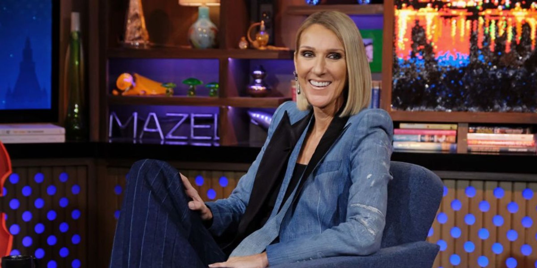 Céline Dion seated on a television program