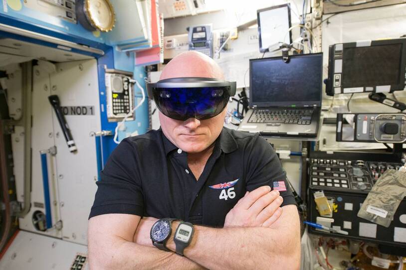 An astronaut wearing a visor inside the space station