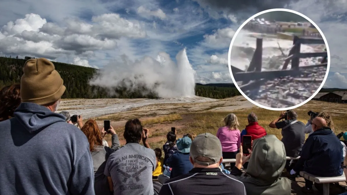 A large crowd standing at a distance watching a large geyser