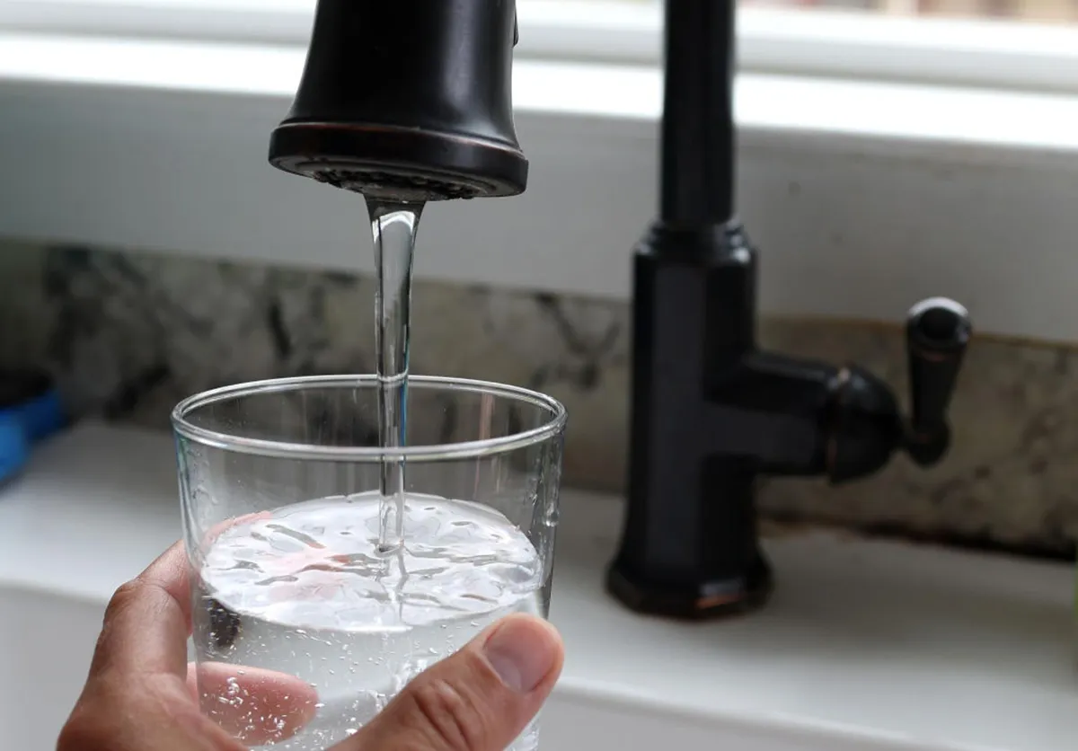 In this photo illustration, water from a tap fills a glass on July 06, 2023, in San Anselmo, California