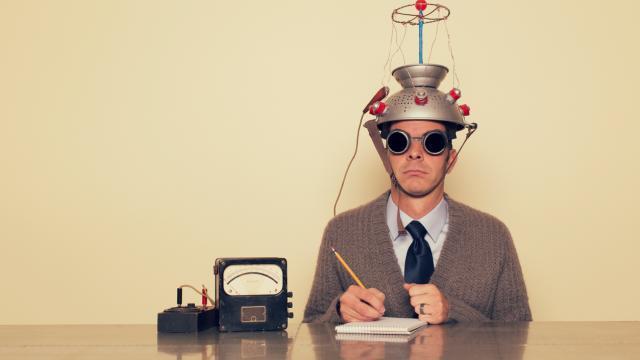 A person in a novelty helmet; illustrative image, not Neuralink medical equipment.